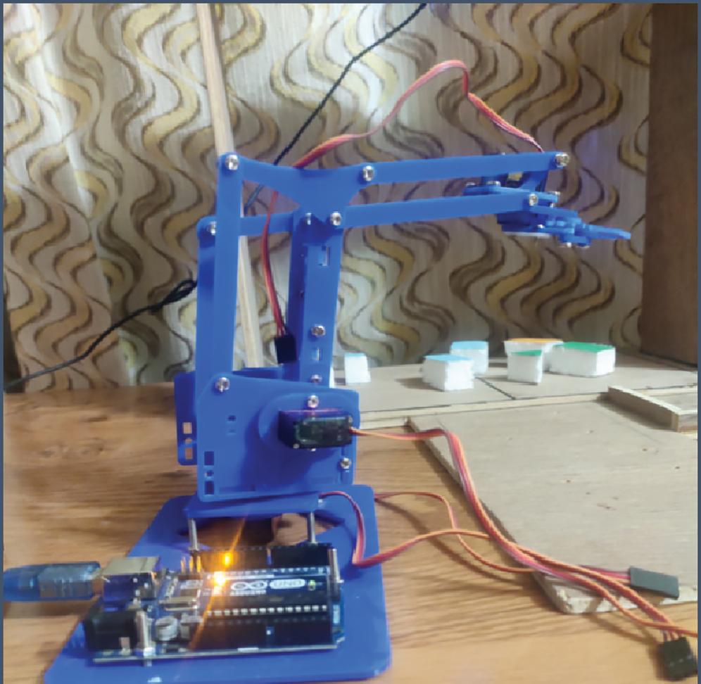 Computer Vision Based Robotic Arm Controlled Using Interactive GUI